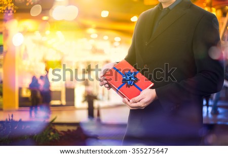 Portrait of business man - giving the gift
