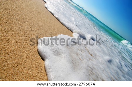 Sea waves on tropical beach in natural harmony