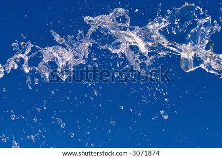 Fresh water SPLASH - water drops floating in the air