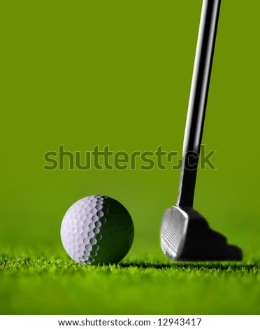 Golf Stick and Ball on the Green Grass with green background