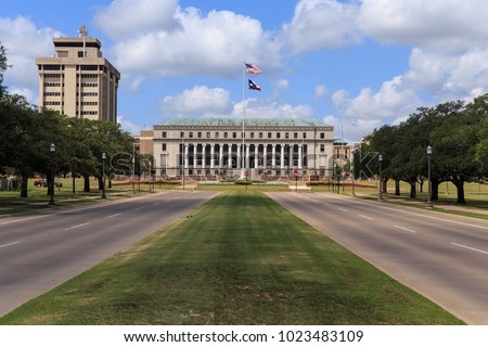 The main entrance to Texas A & M University with the Jack K. Williams Systems Administration building at the end of road in College Station, Texas