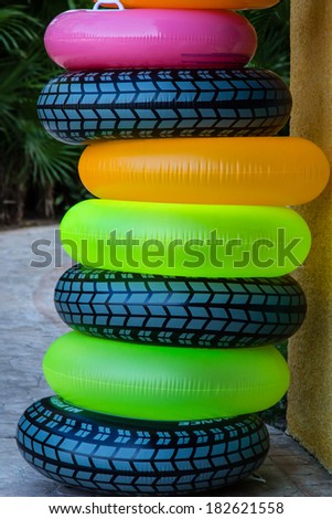 Inflatable Tubes/ Tubes/ A stack of Tubes wait for some swimmers who want to float.