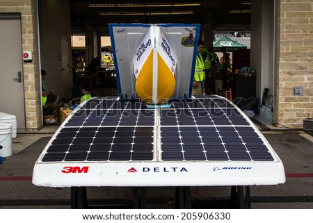 AUSTIN, TX -JULY 19:  Students work on their solar car during the Formula Sun Grand Prix at the Circuit of The Americas in Austin, TX on July 19 2014.