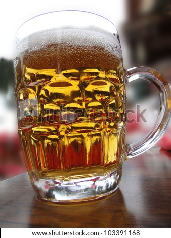 Glass of beer on restaurant table in ski resort at   Chatel,  France