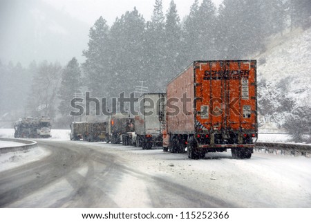 I-84, EASTERN OREGON - Jan 24 - Large trucks fight a winter storm  on the mountain highway   on Jan 24, 2012  in Eastern Oregon