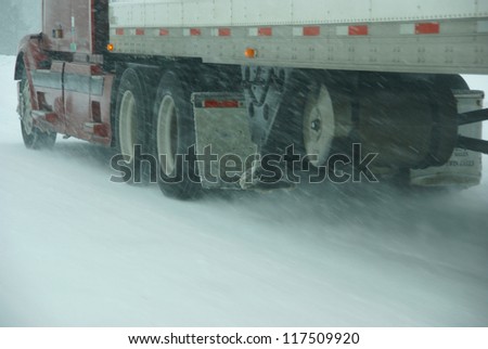 Large trucks fight a winter storm  on the mountain highway   in Eastern Oregon