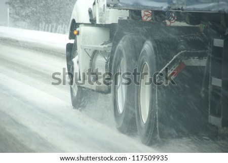 Large trucks fight a winter storm  on the mountain highway   in Eastern Oregon