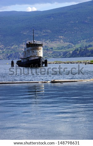 Old tug boat moored on Lake Okanagan, Penticton, British Columbia, Canada..