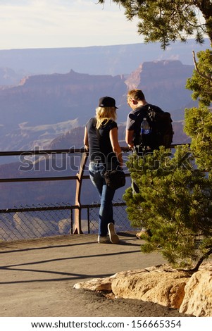 GRAND CANYON, ARIZONA - SEP 29 - A young couple near Powell Point enjoys the view  on Sep 29, 2013 just before the government shutdown, at the Grand Canyon National Park, Arizona