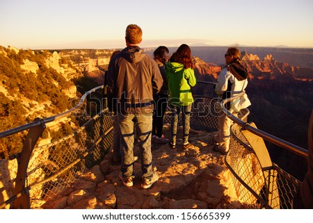 GRAND CANYON, ARIZONA - SEP 27 - Tourists enjoy the sunset from Imperial Point  on Sep 27, 2013 just before the government shutdown, at the Grand Canyon National Park, Arizona