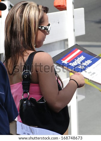 SEATTLE - MAY 15 -  Young woman registers new voters  at a Street Fair on May 15, 2010, in Seattle