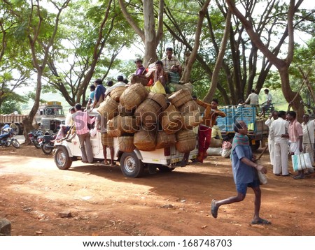 ORISSA,  INDIA - Nov 13 -A truck crowded with people and baskets returns home  after a day at the weekly market on Nov 13, 2009, in Orissa, India