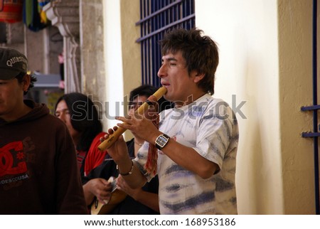 CUSCO, PERU - AUG 29 - Man playing Andean music on pan pipes,  on Aug 29, 2008, in Cusco, Peru, South America