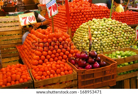 Pyramids of fresh tomatoes, indoor market,   Merced Market, Mexico City,