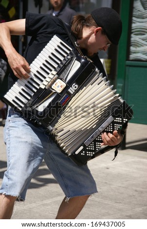 SEATTLE WA - MAY 17, 2009 -  Street musicians playing accordion and guitar at the University Street Fair in Seattle in May, 2009