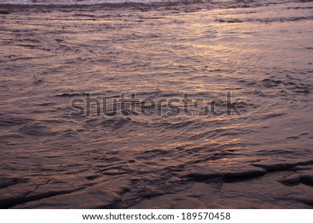 Textures of incoming surf at sunset near Yaquina Head, Newport, Oregon coast