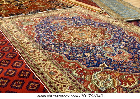 Details of intricate blue patterns in Turkish carpets  in rug store  inGoreme, Cappadocia, Turkey