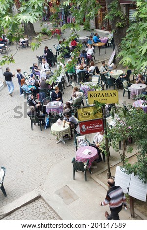BURSA, TURKEY - MAY 22, 2014 - People relax in the tea garden of the Silk Bazaar in  Bursa, Turkey