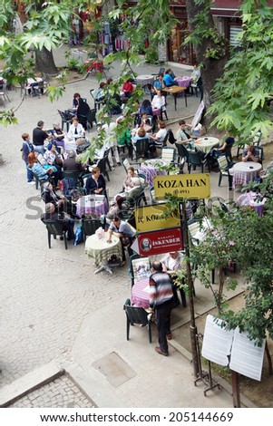 BURSA, TURKEY - MAY 22, 2014 - People relax in the tea garden of the Silk Bazaar in  Bursa, Turkey