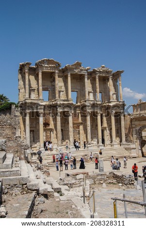 EPHESUS, TURKEY - MAY 25, 2014 - Tourists explore and photograph the Library of Celsus  Ephesus, Turkey