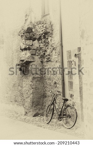Bicycle on narrow street of Beaulieu sur Dordogne, France