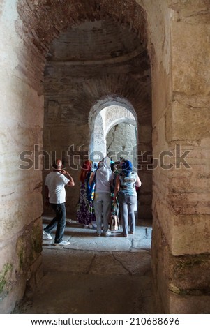DEMRE, TURKEY - JUN 1, 2014 - Russian Orthodox tourists line up to pray at the tomb of St. Nicholas  of Myra,  Turkey