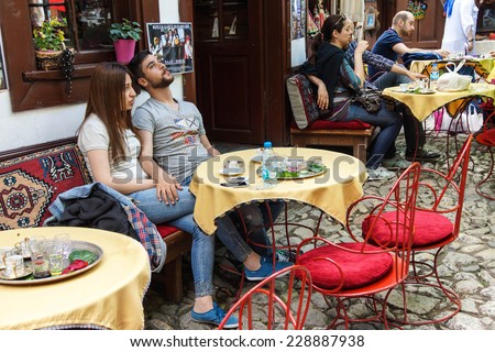 SAFRANBOLU, TURKEY - MAY 19, 2014 - Tourists relax in an outdoor coffee shop in  Safranbolu, Turkey