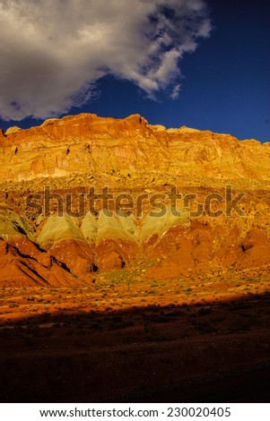 Golden Throne, dramatic backlighting for sedimentary rock of red Navajo sandstone,Capitol Reef National Park, Utah