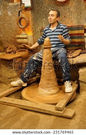 CAPPADOCIA, TURKEY - JUN 4, 2014 - Master craftsman makes pottery on a wheel, Avanos, Turkey