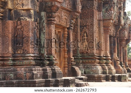 Apsara dancer on walls of intricate temple at  Banteay Srei, Cambodia