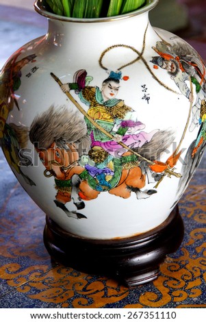 Chinese mounted warrior, painting on vase in Fukian Assembly Hall,  Hoi An, Vietnam