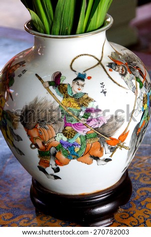Chinese mounted warrior, painting on vase in Fukian Assembly Hall,  Hoi An, Vietnam