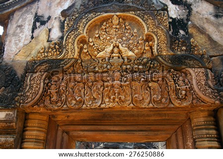 Intricate stone carving on red sandstone doorways and portals,  Banteay Srei, Cambodia