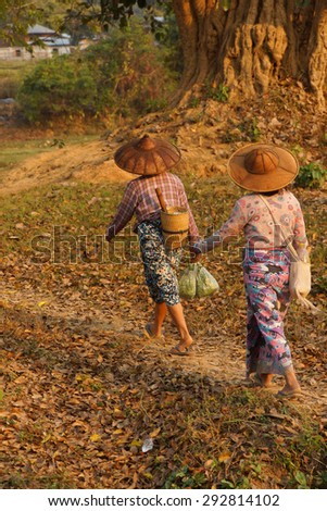 HSIPAW, MYANMAR - FEB 19, 2015 - \
Local village women return home in the evening after working in their fields,  Hsipaw,  Myanmar (Burma)