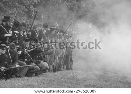 PORT GAMBLE, WA - JUN 20: Civil War reenactors participate in a mock battle. Union infantry line firing a volley.