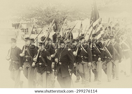 PORT GAMBLE, WA - JUN 20: Civil War reenactors participate in a mock battle. Union army marching to battle in column formation. on Jun 20, 2009 in Port Gamble, WA.
