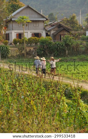 HSIPAW, MYANMAR - FEB 19, 2015 -  Local village women return home in the evening after working in their fields,  Hsipaw,  Myanmar (Burma)
