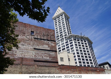 SEATTLE - JUL 23, 2015 - The Smith Tower rises above old brick building near Pioneer SquareSeattle, Washington