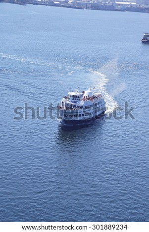 SEATTLE - JUL 20, 2015 - Tour boat cruises the harbor on a tour of  Seattle, Washington