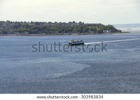 Washington State ferry crosses Puget Sound and nears  Seattle, Washington