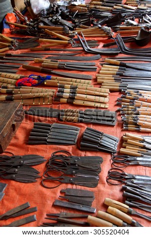 Handmade knives and other steel tools for sale  at a weekly market on Inle Lake,  Myanmar (Burma)
