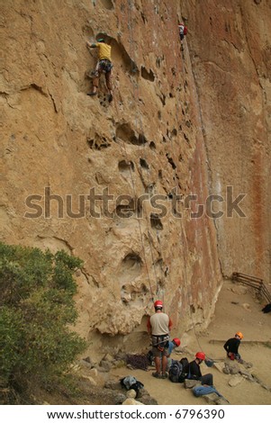 Potholes, climbers on rock face,		Smith Rock State Park, 	Central Oregon