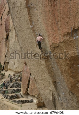 Climber on overhanging cliff route,		Smith Rock State Park, 	Central Oregon