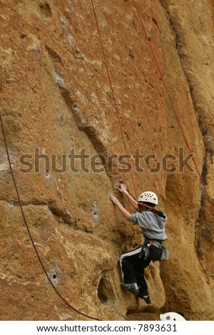 Climber on sheer rock face,		Smith Rock State Park, 	Central Oregon