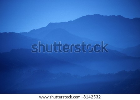 Sunset, blue ridges,	near	Kangchenjunga in	Nepal