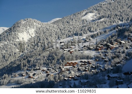 New snow on chalets in village,		Chatel,French Alps,	France