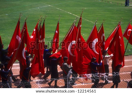 Red Turkish flags carried by school children, 	Turkish Independence day celebrations,	Erzerum,	Turkey, Middle East