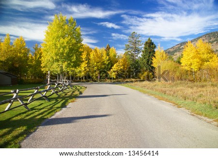 Autumn road and rail fence, Golden aspens,	Moose - Wilson Road, Teton village,	Grand Teton National Park,	Wyoming