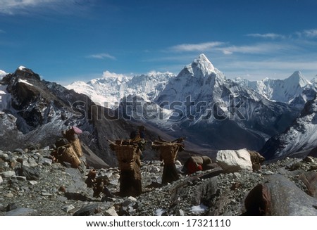 Sherpanis carrying climbing loads over 17,000 feet. 	Chyungma Pass	Khumbu Himalaya,	Nepal