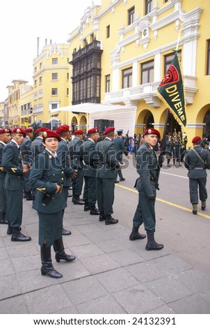 LIMA, PERU - AUGUST 30: Police officers  in red berets watch a parade in Lima, Peru on August 30, 2008.